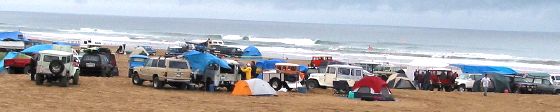 A large Land Cruiser city sprung up on the beach.